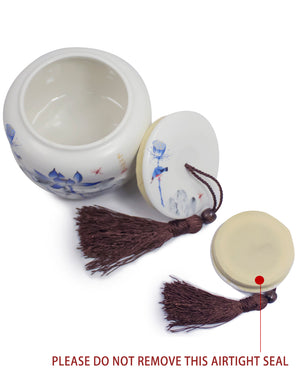 [product type] | Dahlia Lotus Blue and White Porcelain Tea Canister with Tassel | Dahlia